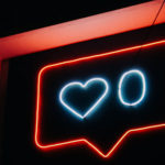 neon sign of 0 hearts on social media