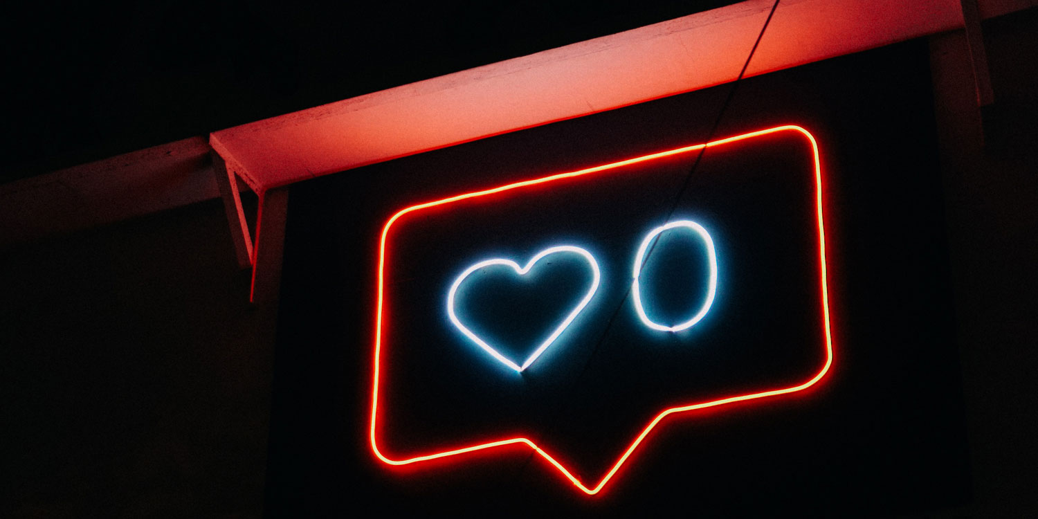 neon sign of 0 hearts on social media